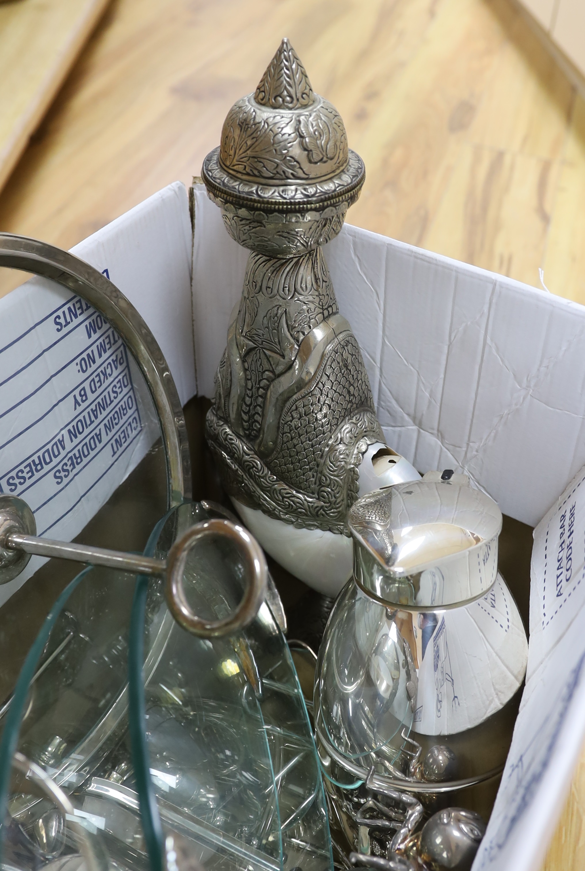 A collection of plated wares including fish serving dishes, insect sauce container and a circular glass tray